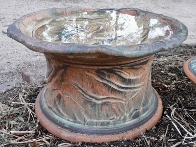 This hunky, chunky little bird bath became a water dish for a Basset Hound.